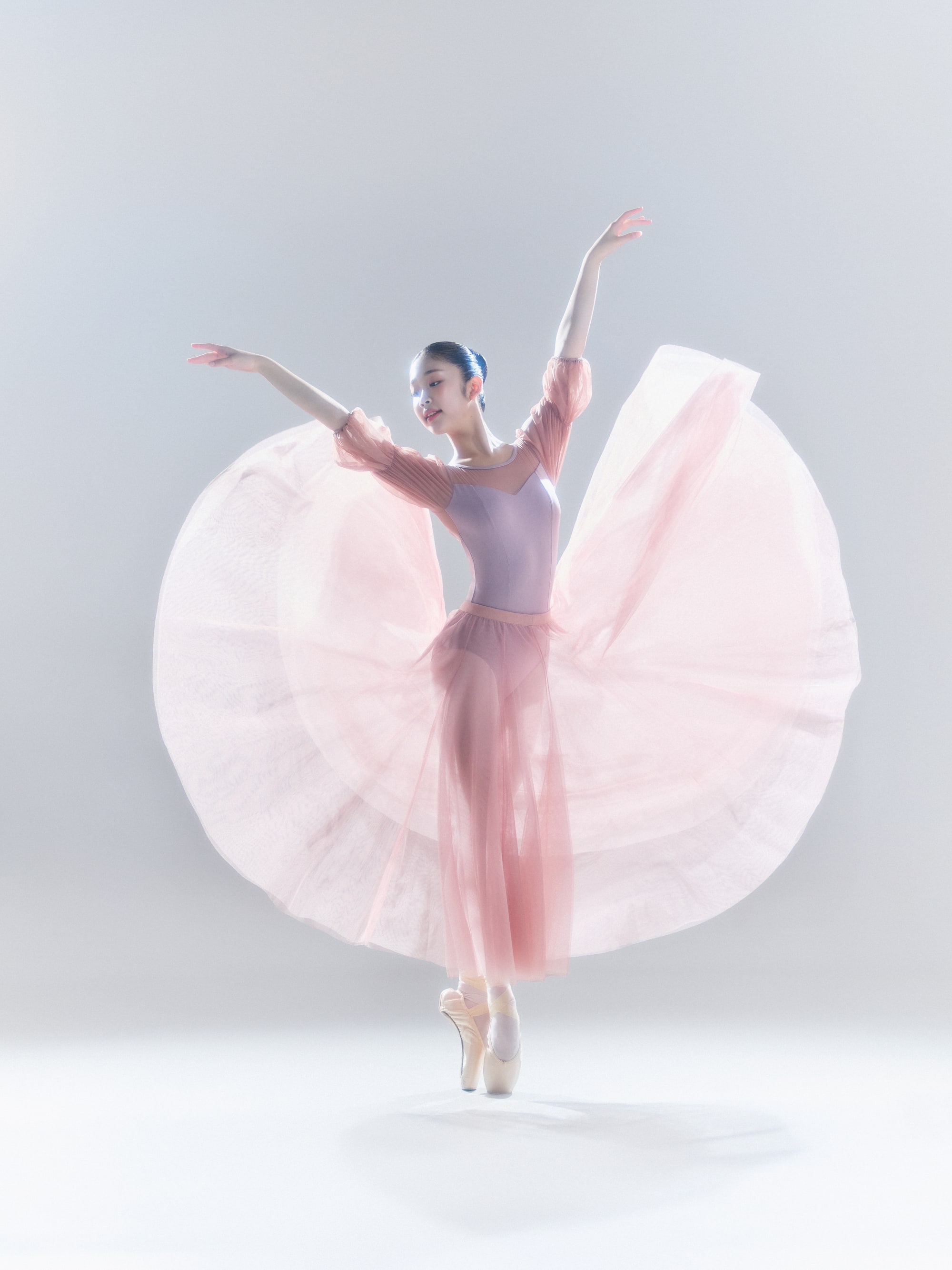 Turning en pointe, pink skirt fanning out